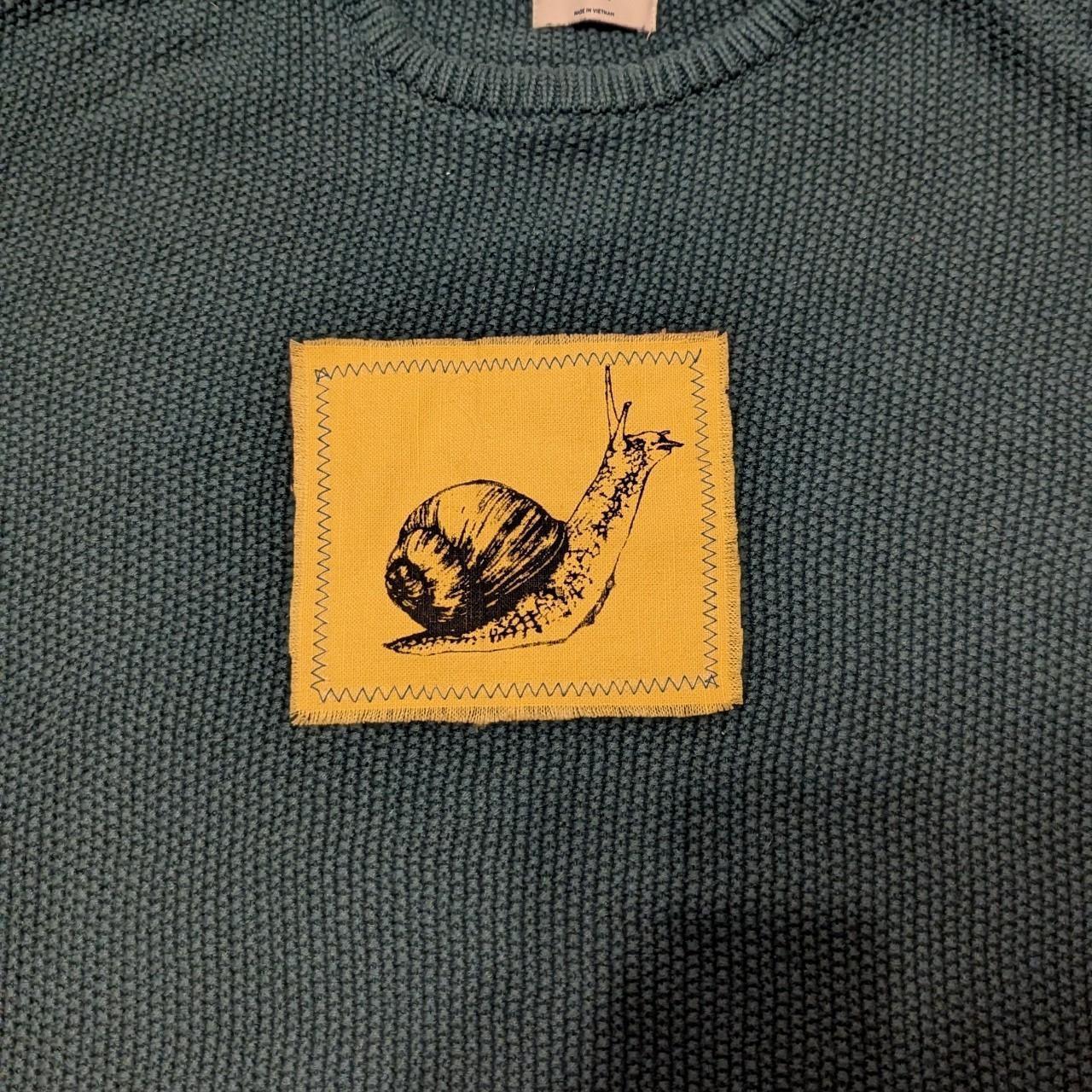 Large snail patch sweater